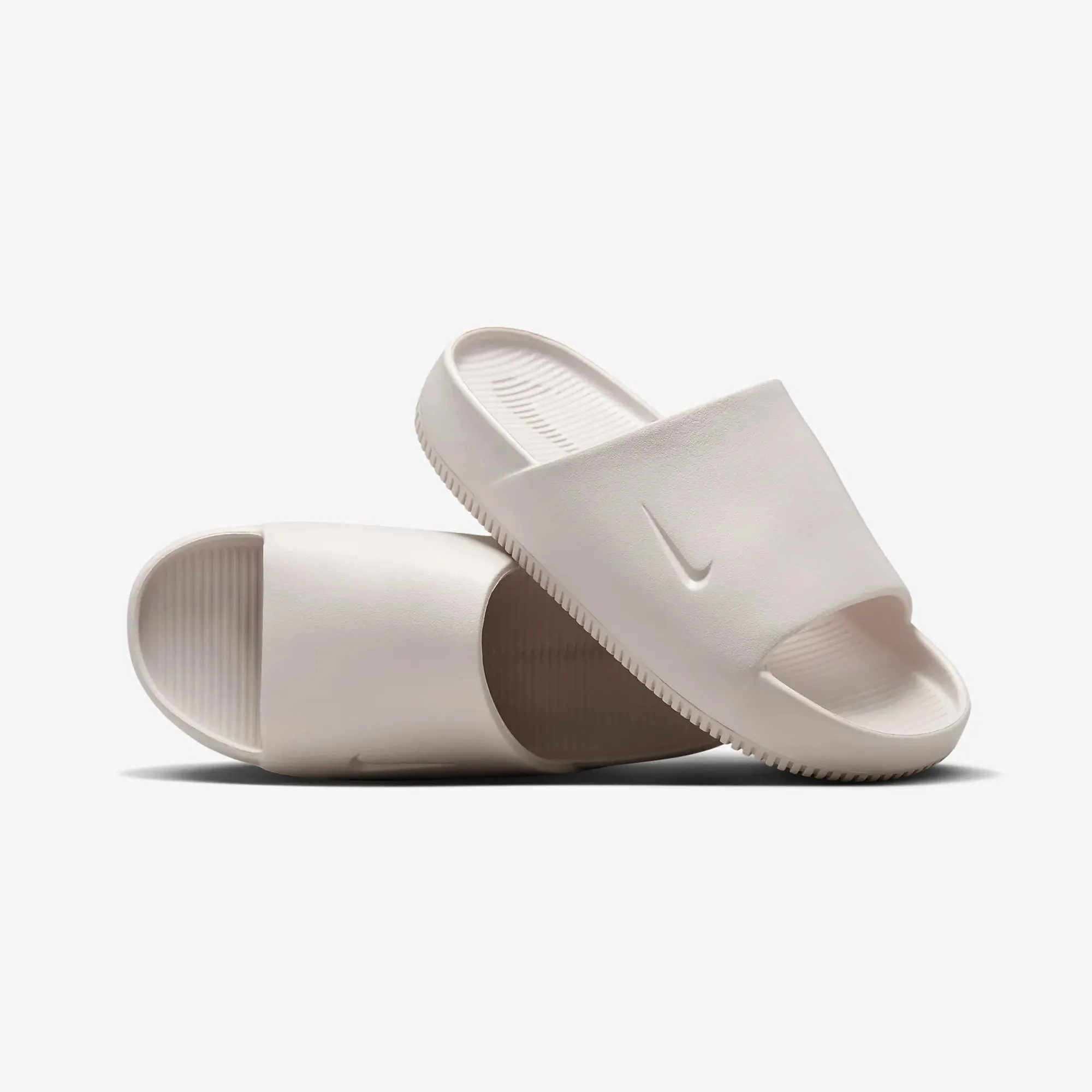 Nike | WMN'S CALM SLIDES  { BARELY ROSE/BARELY ROSE